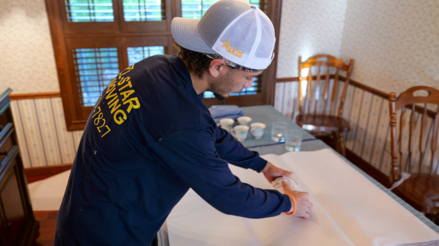 worker packing up household items